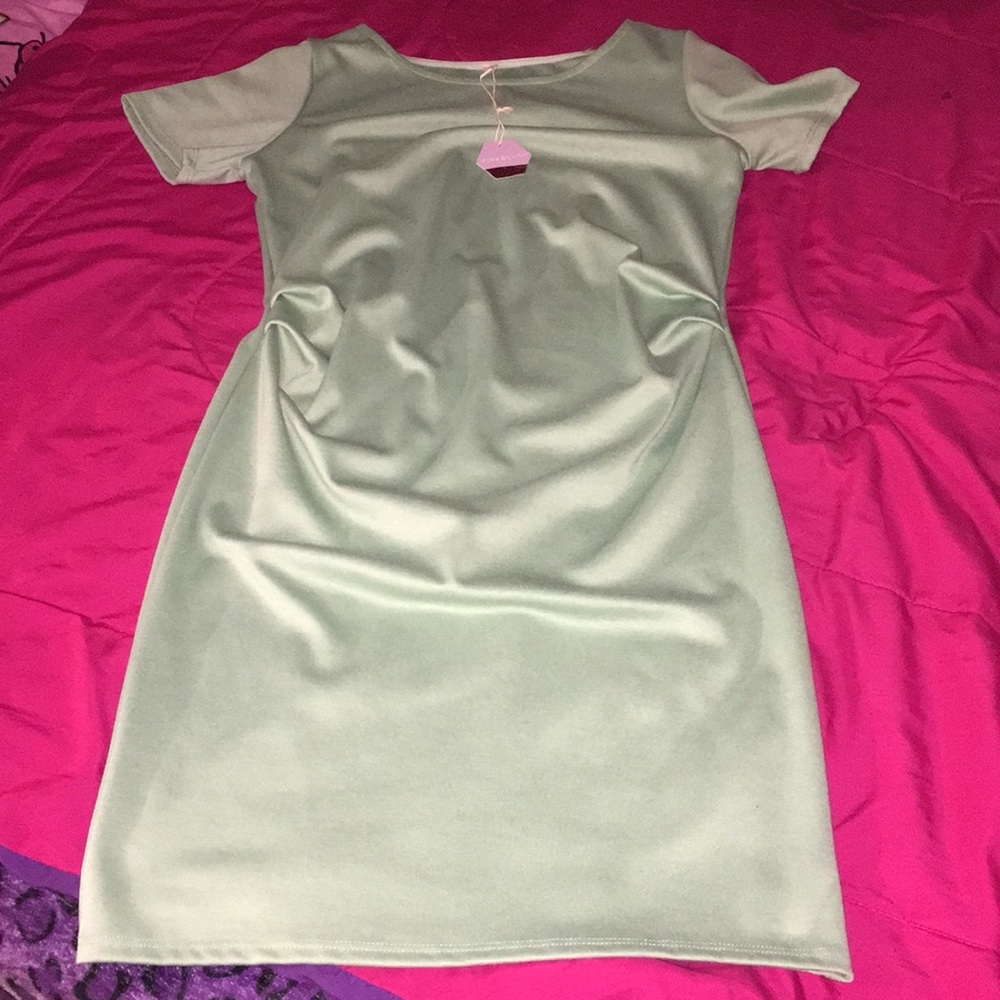 Maternity light green dress knee length  . Offer.